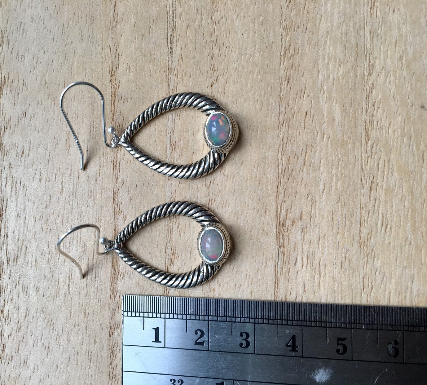 Opal dangly silver earrings Oval
