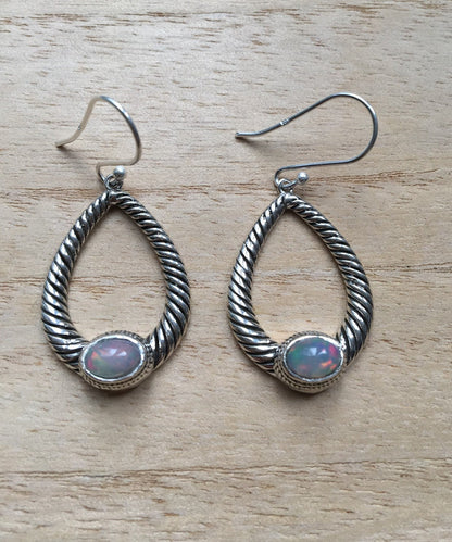 Opal dangly silver earrings Oval